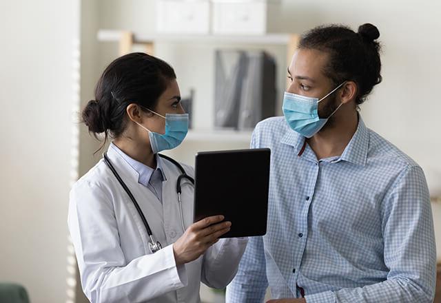 a man talking to a doctor